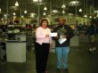 2008 Chair, Judy Wolgast accepts a $1,000 check from Sam's Club for sponsorship of Friday Night Live. 